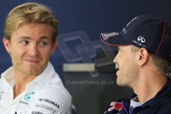 World © Octane Photographic Ltd. Thursday 17th July 2014. German GP, Hockenheim Formula 1 FIA Press Conference. Infiniti Red Bull Racing RB10 - Sebastian Vettel talkes with Mercedes AMG Petronas F1 W05 Hybrid - Nico Rosberg. Digital Ref: 1033LB1D3910