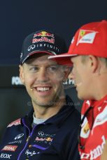 World © Octane Photographic Ltd. Thursday 17th July 2014. German GP, Hockenheim - Formula 1 FIA Press Conference. Scuderia Ferrari F14T – Kimi Raikkonen shares a laugh with Infiniti Red Bull Racing RB10 - Sebastian Vettel. Digital Ref: 1033LB1D4134