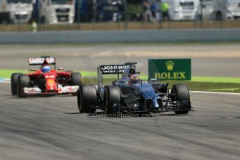 World © Octane Photographic Ltd. Friday 18th July 2014. German GP, Hockenheim. - Formula 1 Practice 2. McLaren Mercedes MP4/29 - Jenson Button and Scuderia Ferrari F14T - Fernando Alonso. Digital Ref: 1037LB1D5160