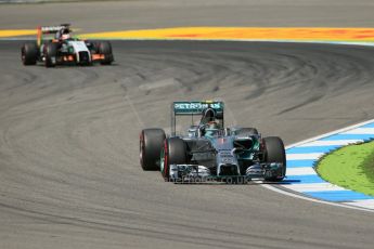 World © Octane Photographic Ltd. Friday 18th July 2014. German GP, Hockenheim. - Formula 1 Practice 2. Mercedes AMG Petronas F1 W05 Hybrid - Nico Rosberg and Sahara Force India VJM07 – Nico Hulkenburg. Digital Ref: 1037LB1D5412