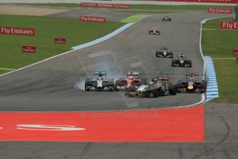 World © Octane Photographic Ltd. Sunday 20th July 2014. German GP, Hockenheim. - Formula 1 Race. Mercedes AMG Petronas F1 W05 Hybrid – Lewis Hamilton and Scuderia Ferrari F14T – Kimi Raikkonen come together. Digital Ref :