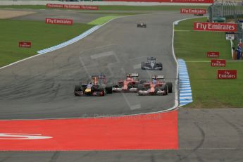 World © Octane Photographic Ltd. Sunday 20th July 2014. German GP, Hockenheim. Formula 1 Race. Infiniti Red Bull Racing RB10 - Sebastian Vettel andScuderia Ferrari F14T - Fernando Alonso and Kimi Raikkonen who is just about to loose a front wing endplate. Digital Ref: