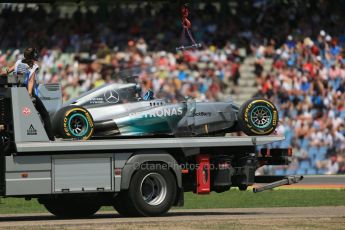 World © Octane Photographic Ltd. Saturday 19th July 2014. German GP, Hockenheim. - Formula 1 Qualifying. Mercedes AMG Petronas F1 W05 Hybrid – Lewis Hamilton's wrecked car being recovered after rear brake failure. Digital Ref: