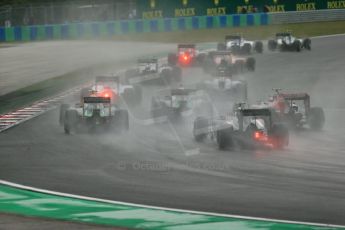 World © Octane Photographic Ltd. Sunday 27th July 2014. Hungarian GP, Hungaroring - Budapest. Race. The grid going around turn 1. Digital Ref: 1073LB1D3378