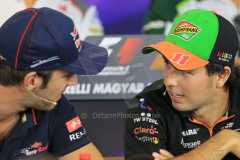 World © Octane Photographic Ltd. Thursday 24th July 2014. Hungarian GP, Hungaroring - Budapest - Formula 1 FIA Press Conference. Sahara Force India VJM07 – Sergio Perez talks with Scuderia Toro Rosso driver Jean-Eric Vergne. Digital Ref: 1054LB1D9132