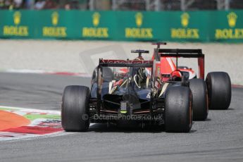 World © Octane Photographic Ltd. Sunday 7th September 2014, Italian GP, Monza - Italy. - Formula 1 Race. Scuderia Ferrari F14T - Fernando Alonso and Lotus F1 Team E22 - Romain Grosjean. Digital Ref: 1112LB1D6370