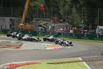 World © Octane Photographic Ltd. Sunday 7th September 2014, Italian GP, Monza - Italy. - Formula 1 Race. Mercedes AMG Petronas F1 W05 Hybrid - Nico Rosberg leads the pack into turn 1 on lap 1 ahead of McLaren Mercedes MP4/29 – Kevin Magnussen and Williams Martini Racing FW36 – Felipe Massa. Digital Ref: 1112LB1D7808