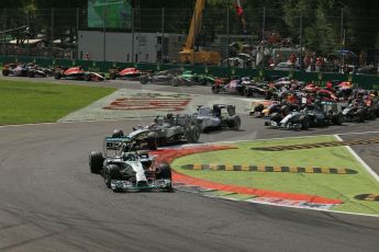 World © Octane Photographic Ltd. Sunday 7th September 2014, Italian GP, Monza - Italy. - Formula 1 Race. Mercedes AMG Petronas F1 W05 Hybrid - Nico Rosberg leads the pack around the 1st chicane on lap 1 ahead of McLaren Mercedes MP4/29 – Kevin Magnussen and Williams Martini Racing FW36 – Felipe Massa. Digital Ref: 1112LB1D7815