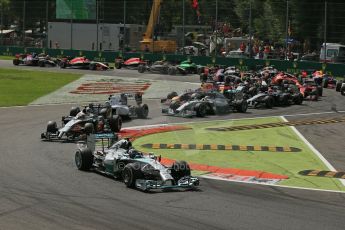 World © Octane Photographic Ltd. Sunday 7th September 2014, Italian GP, Monza - Italy. - Formula 1 Race. Mercedes AMG Petronas F1 W05 Hybrid - Nico Rosberg leads the pack around the 1st chicane on lap 1 ahead of McLaren Mercedes MP4/29 – Kevin Magnussen and Williams Martini Racing FW36 – Felipe Massa. Digital Ref: 1112LB1D7818