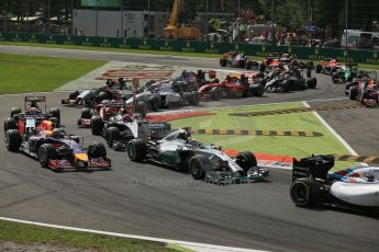 World © Octane Photographic Ltd. Sunday 7th September 2014, Italian GP, Monza - Italy. - Formula 1 Race. Mercedes AMG Petronas F1 W05 Hybrid – Lewis Hamilton had a poor start and had to fight through turn 1 chicane and Danial Ricciardo's Red Bull misses the 1st turn. Digital Ref: 1112LB1D7829