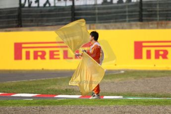 World © Octane Photographic Ltd. Friday 3rd October 2014, Japanese Grand Prix - Suzuka. - Formula 1 Practice 2. Flag Marshal. Digital Ref :