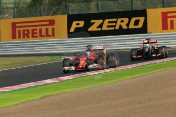 World © Octane Photographic Ltd. Friday 3rd October 2014, Japanese Grand Prix - Suzuka. - Formula 1 Practice 2. Scuderia Ferrari F14T - Fernando Alonso and Lotus F1 Team E22 - Romain Grosjean. Digital Ref:
