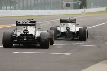 World © Octane Photographic Ltd. Saturday 4th October 2014, Japanese Grand Prix - Suzuka. - Formula 1 Practice 3. Mercedes AMG Petronas F1 W05 Hybrid – Lewis Hamilton and McLaren Mercedes MP4/29 - Jenson Button. Digital Ref: