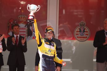 World © Octane Photographic Ltd. Friday 23rd May 2014. GP2 Feature Race – Monaco, Monte Carlo. Felipe Nasr raises hos 3rd place trophy - Carlin. Digital Ref : 0963CB7D3142