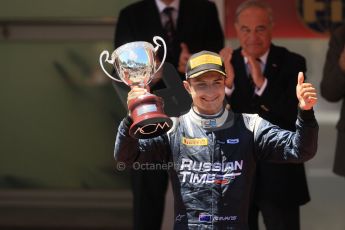 World © Octane Photographic Ltd. Friday 23rd May 2014. GP2 Feature Race – Monaco, Monte Carlo. Mitch Evans raises his 2nd place trophy - RT Russian Time. Digital Ref : 0963LB1D7287