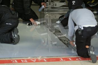World © Octane Photographic Ltd. Tuesday 8th July 2014. British in-season Formula 1 test, Silverstone, UK. McLaren Mercedes MP4/29 tire marks on garage floor. Digital Ref: 1029LB1D2237