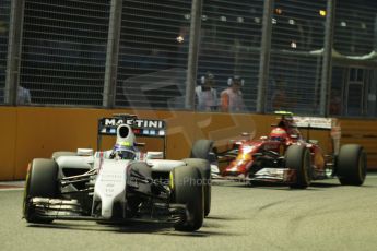 World © Octane Photographic Ltd. Friday 19th September 2014, Singapore Grand Prix, Marina Bay. - Formula 1 Practice 1. Williams Martini Racing FW36 – Valtteri Bottas and Scuderia Ferrari F14T – Kimi Raikkonen. Digital Ref: