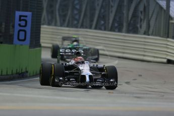 World © Octane Photographic Ltd. Friday 19th September 2014, Singapore Grand Prix, Marina Bay. - Formula 1 Practice 1. McLaren Mercedes MP4/29 - Jenson Button and Caterham F1 Team CT05 – Marcus Ericsson. Digital Ref: