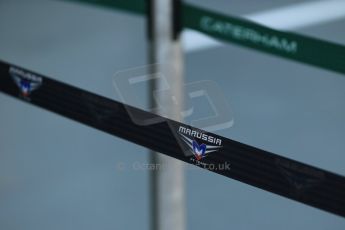 World © Octane Photographic Ltd. Wednesday 17th September 2014, Singapore Grand Prix, Marina Bay. Formula 1 Setup and atmosphere. Caterham F1 Team and Marussia F1 team pit barriers. Digital Ref: 1115LB1D8724