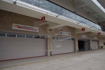 World © Octane Photographic Ltd. F1 USA GP, Austin, Texas, Circuit of the Americas (COTA). Wednesday 30th October 2014 – Pitlane setup. Empty Marussia garages. Digital Ref : 1141LB1D3395