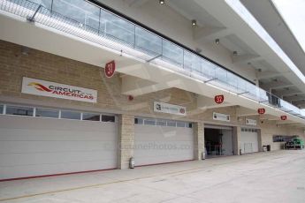 World © Octane Photographic Ltd. F1 USA GP, Austin, Texas, Circuit of the Americas (COTA). Wednesday 30th October 2014 – Pitlane setup. Empty Marussia and Caterham garages. Digital Ref : 1141LB1D3399