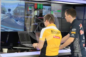 World © Octane Photographic Ltd. Renault personnel in the Infiniti Red Bull Racing garage. Friday 27th November 2015, F1 Abu Dhabi Grand Prix, Practice 1, Yas Marina. Digital Ref: 1477CB1L4832