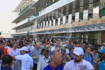 World © Octane Photographic Ltd. Fans in the pit lane to meet drivers. Thursday 26th November 2015, F1 Abu Dhabi Grand Prix, Setup, Yas Marina. Digital Ref: 1472CB7D1312