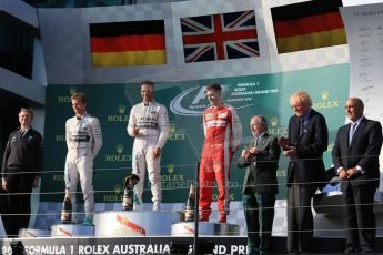 World © Octane Photographic Ltd. Mercedes AMG Petronas F1 W06 Hybrid – Lewis Hamilton (1st), Nico Rosberg (2nd) and Scuderia Ferrari SF15-T– Sebastian Vettel (3rd). Sunday 15th March 2015, F1 Australian GP Podium, Melbourne, Albert Park, Australia. Digital Ref: 1210LB1D0249