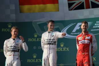 World © Octane Photographic Ltd. Mercedes AMG Petronas F1 W06 Hybrid – Lewis Hamilton (1st), Nico Rosberg (2nd) and Scuderia Ferrari SF15-T– Sebastian Vettel (3rd). Sunday 15th March 2015, F1 Australian GP Podium, Melbourne, Albert Park, Australia. Digital Ref: 1210LB1D0266