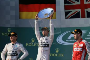 World © Octane Photographic Ltd. Mercedes AMG Petronas F1 W06 Hybrid – Lewis Hamilton (1st), Nico Rosberg (2nd) and Scuderia Ferrari SF15-T– Sebastian Vettel (3rd). Sunday 15th March 2015, F1 Australian GP Podium, Melbourne, Albert Park, Australia. Digital Ref: 1210LB1D0294