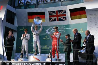 World © Octane Photographic Ltd. Mercedes AMG Petronas F1 W06 Hybrid – Lewis Hamilton (1st), Nico Rosberg (2nd) and Scuderia Ferrari SF15-T– Sebastian Vettel (3rd). Sunday 15th March 2015, F1 Australian GP Podium, Melbourne, Albert Park, Australia. Digital Ref: 1210LB1D0306
