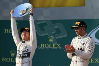 World © Octane Photographic Ltd. Mercedes AMG Petronas F1 W06 Hybrid – Lewis Hamilton (1st) and Nico Rosberg (2nd). Sunday 15th March 2015, F1 Australian GP Podium, Melbourne, Albert Park, Australia. Digital Ref: 1210LB1D0330