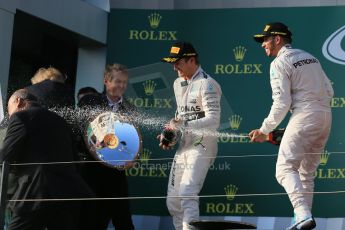 World © Octane Photographic Ltd. Mercedes AMG Petronas F1 W06 Hybrid – Lewis Hamilton (1st) and Nico Rosberg (2nd). Sunday 15th March 2015, F1 Australian GP Podium, Melbourne, Albert Park, Australia. Digital Ref: 1210LB1D0375