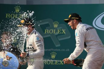 World © Octane Photographic Ltd. Mercedes AMG Petronas F1 W06 Hybrid – Lewis Hamilton (1st) and Nico Rosberg (2nd). Sunday 15th March 2015, F1 Australian GP Podium, Melbourne, Albert Park, Australia. Digital Ref: 1210LB1D0380