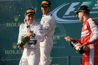 World © Octane Photographic Ltd. Mercedes AMG Petronas F1 W06 Hybrid – Lewis Hamilton (1st), Nico Rosberg (2nd) and Scuderia Ferrari SF15-T– Sebastian Vettel (3rd). Sunday 15th March 2015, F1 Australian GP Podium, Melbourne, Albert Park, Australia. Digital Ref: 1210LB1D0435