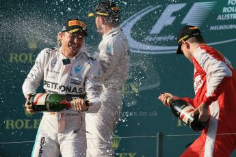 World © Octane Photographic Ltd. Mercedes AMG Petronas F1 W06 Hybrid – Lewis Hamilton (1st), Nico Rosberg (2nd) and Scuderia Ferrari SF15-T– Sebastian Vettel (3rd). Sunday 15th March 2015, F1 Australian GP Podium, Melbourne, Albert Park, Australia. Digital Ref: 1210LB1D0441