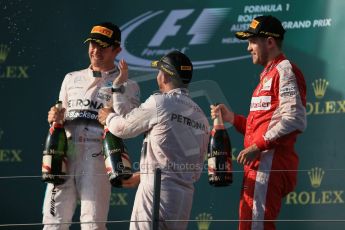 World © Octane Photographic Ltd. Mercedes AMG Petronas F1 W06 Hybrid – Lewis Hamilton (1st), Nico Rosberg (2nd) and Scuderia Ferrari SF15-T– Sebastian Vettel (3rd). Sunday 15th March 2015, F1 Australian GP Podium, Melbourne, Albert Park, Australia. Digital Ref: 1210LB1D0520