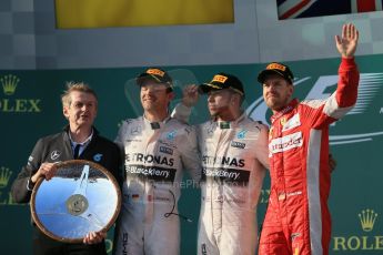 World © Octane Photographic Ltd. Mercedes AMG Petronas F1 W06 Hybrid – Lewis Hamilton (1st), Nico Rosberg (2nd) and Scuderia Ferrari SF15-T– Sebastian Vettel (3rd). Sunday 15th March 2015, F1 Australian GP Podium, Melbourne, Albert Park, Australia. Digital Ref: 1210LB1D0586
