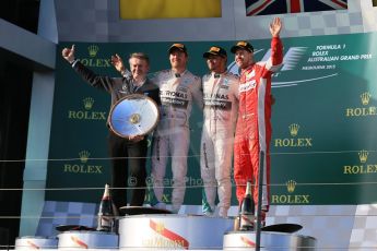 World © Octane Photographic Ltd. Mercedes AMG Petronas F1 W06 Hybrid – Lewis Hamilton (1st), Nico Rosberg (2nd) and Scuderia Ferrari SF15-T– Sebastian Vettel (3rd). Sunday 15th March 2015, F1 Australian GP Podium, Melbourne, Albert Park, Australia. Digital Ref: 1210LB1D0597