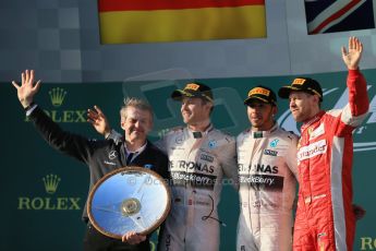 World © Octane Photographic Ltd. Mercedes AMG Petronas F1 W06 Hybrid – Lewis Hamilton (1st), Nico Rosberg (2nd) and Scuderia Ferrari SF15-T– Sebastian Vettel (3rd). Sunday 15th March 2015, F1 Australian GP Podium, Melbourne, Albert Park, Australia. Digital Ref: 1210LB1D0607