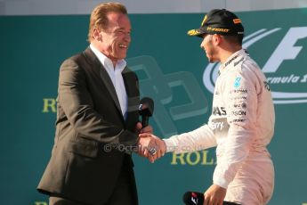 World © Octane Photographic Ltd. Mercedes AMG Petronas F1 W06 Hybrid – Lewis Hamilton (1st) with Arnold (Arnie) Schwarzenegger. Sunday 15th March 2015, F1 Australian GP Podium, Melbourne, Albert Park, Australia. Digital Ref: 1210LB1D0634