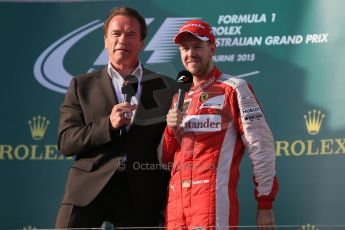 World © Octane Photographic Ltd. Scuderia Ferrari SF15-T– Sebastian Vettel (3rd) and Arnold (Arnie) Schwarzenegger. Sunday 15th March 2015, F1 Australian GP Podium, Melbourne, Albert Park, Australia. Digital Ref: 1210LB1D0748