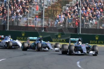 World © Octane Photographic Ltd. Into the 1st corner, Mercedes AMG Petronas F1 W06 Hybrid – Lewis Hamilton leads Nico Rosberg ahead of Williams Martini Racing FW37 – Felipe Massa. Sunday . Sunday 15th March 2015, F1 Australian GP Race, Melbourne, Albert Park, Australia. Digital Ref: 1209LB1D9312