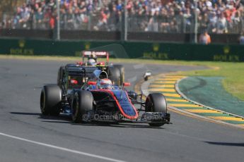 World © Octane Photographic Ltd. McLaren Honda MP4/30 - Jenson Button and Lotus F1 Team E23 Hybrid – Romain Grosjean. Sunday 15th March 2015, F1 Australian GP Race, Melbourne, Albert Park, Australia. Digital Ref: 1209LB1D9349
