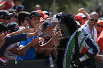 World © Octane Photographic Ltd. Senegalese jewelry designer 'Moko with the fans on "Champions Walk". Saturday 14th March 2015, F1 Australian GP Paddock, Melbourne, Albert Park, Australia. Digital Ref: 1205LB1D6600