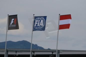 World © Octane Photographic Ltd. Pirelli Intermediate tyres on McLaren Honda wheels. Thursday 18th June 2015, F1 Paddock, Red Bull Ring, Spielberg, Austria. F1, FIA and Austrian flags flying. Digital Ref: 1302CB7D3093