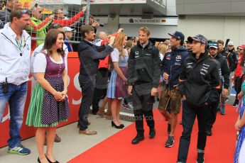 World © Octane Photographic Ltd. McLaren Honda MP4/30 - Jenson Button, Infiniti Red Bull Racing RB11 – Daniel Ricciardo and Sahara Force India VJM08 – Sergio Perez. Sunday 21st June 2015, F1 Austrian GP Grid, Red Bull Ring, Spielberg, Austria. Digital Ref: 1318LW1L3909