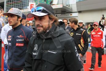 World © Octane Photographic Ltd. McLaren Honda MP4/30 – Fernando Alonso and Scuderia Toro Rosso STR10 – Carlos Sainz Jnr. Sunday 21st June 2015, F1 Austrian GP Grid, Red Bull Ring, Spielberg, Austria. Digital Ref: 1318LW1L3924