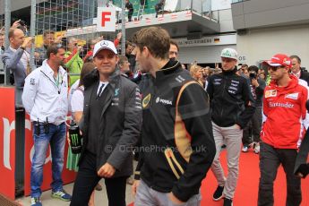 World © Octane Photographic Ltd. Mercedes AMG Petronas F1 W06 Hybrid – Nico Rosberg and Lotus F1 Team E23 Hybrid – Romain Grosjean. . Sunday 21st June 2015, F1 Grid, Red Bull Ring, Spielberg, Austria. Digital Ref: 1318LW1L3926