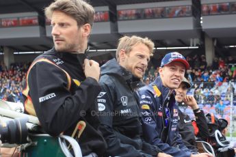 World © Octane Photographic Ltd. Lotus F1 Team E23 Hybrid – Romain Grosjean, McLaren Honda MP4/30 - Jenson Button, Infiniti Red Bull Racing RB11 – Daniil Kvyat and Pastor Maldonado. Sunday 21st June 2015, F1 Austrian GP Grid, Red Bull Ring, Spielberg, Austria. Digital Ref: 1318LW1L3942